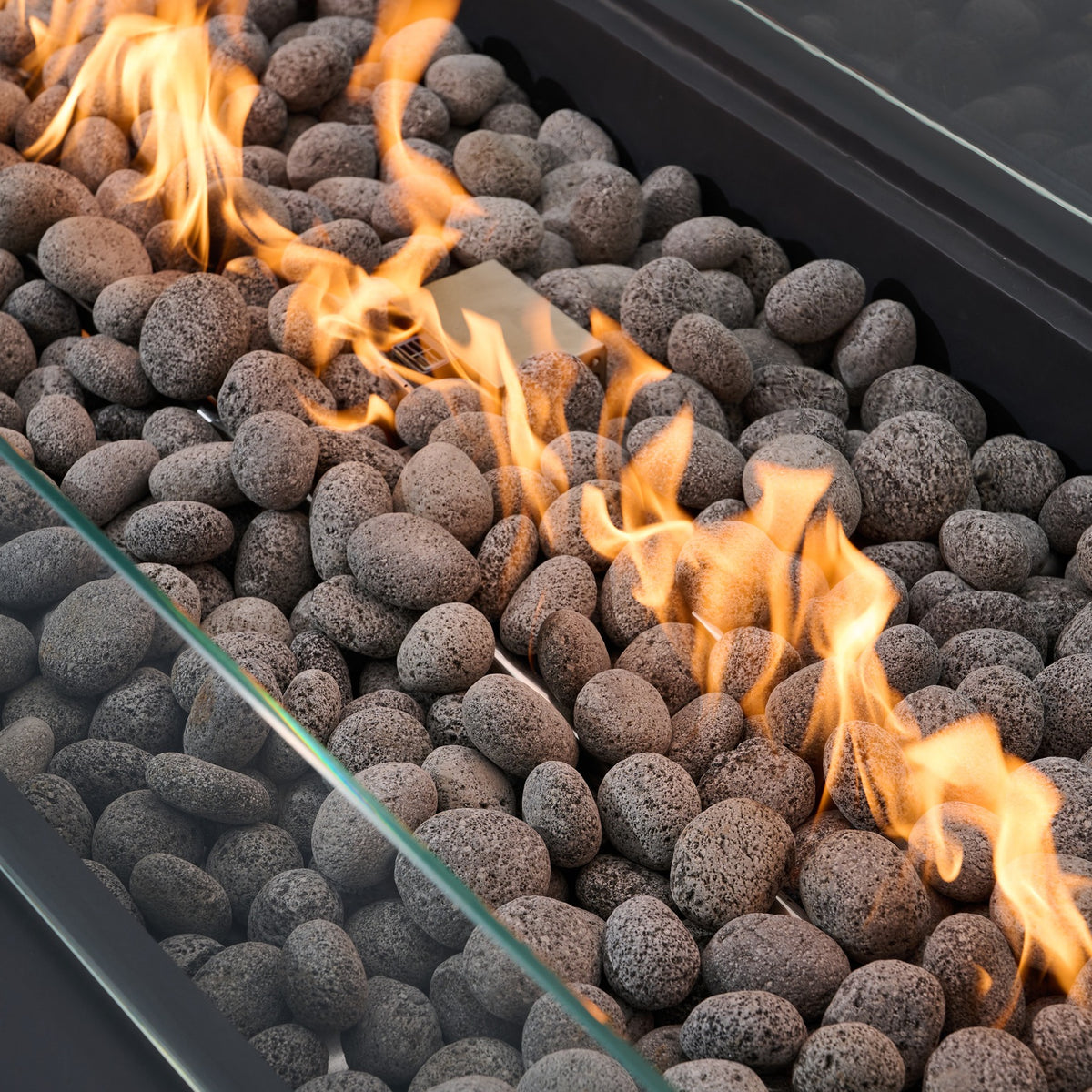 Elementi Pro Ravello 72-inch rectangle fire pit, Dark Gray – close-up of flames over lava rock