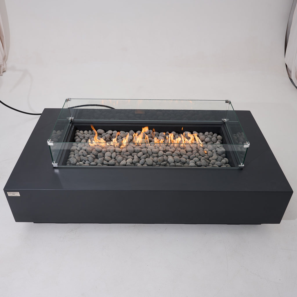 Elementi Pro Ravello 72-inch rectangle fire pit, Dark Gray – front view with glass wind guard, lit