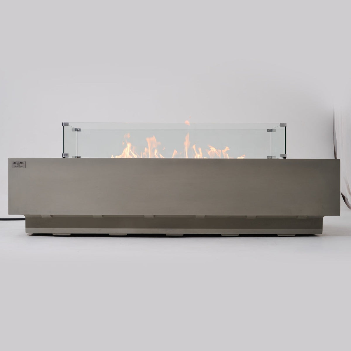 Elementi Pro Ravello 72-inch rectangle fire pit, Light Gray – low side profile, lit