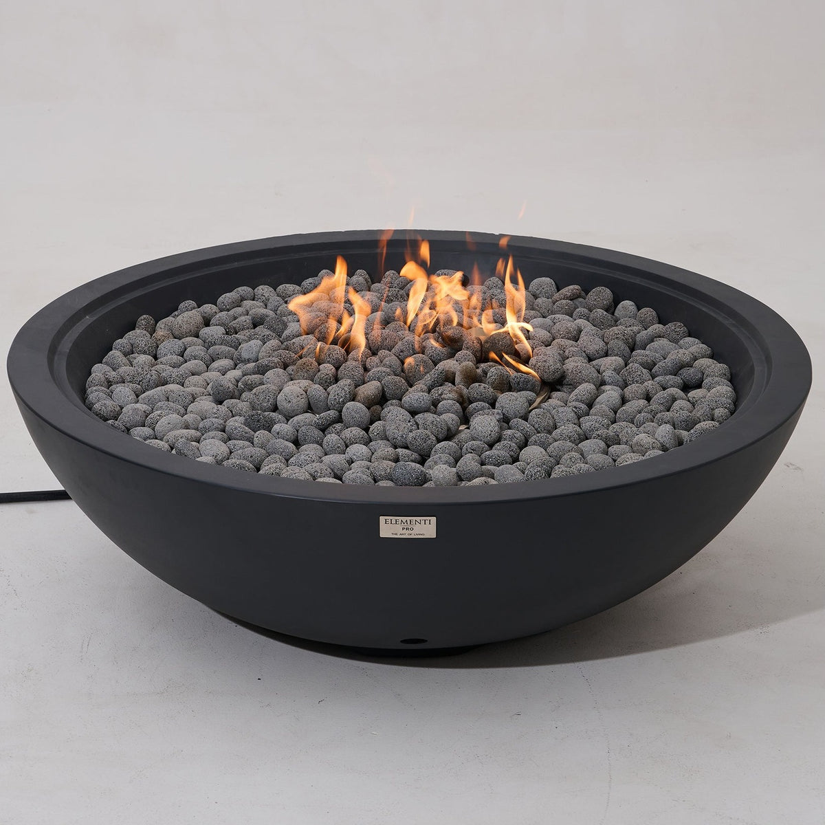 Elementi Pro Rose Bowl 48-inch 100K BTU fire pit, Dark Gray – angled view, lit