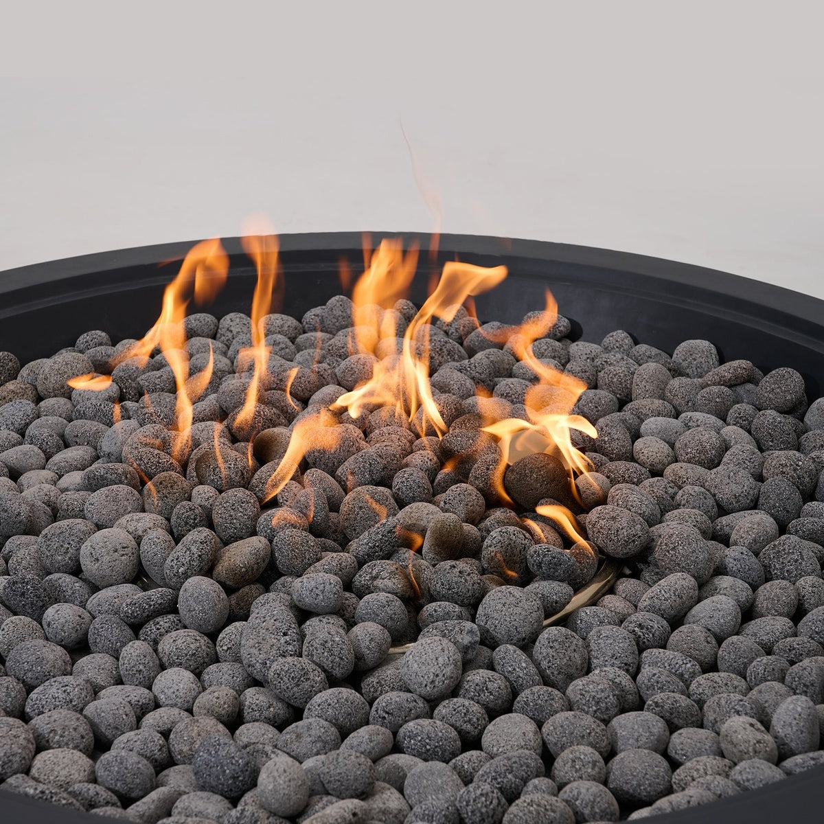 Elementi Pro Rose Bowl 48-inch 100K BTU fire pit, Dark Gray – close-up of flames over lava rock