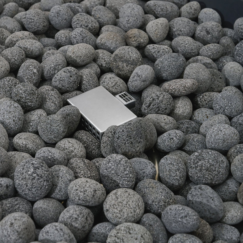 Elementi Pro Rose Bowl 48-inch 100K BTU fire pit, Dark Gray – burner and lava rock close-up