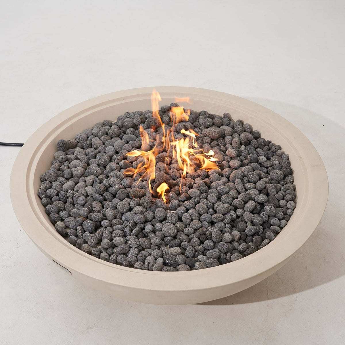 Elementi Pro Rose Bowl 48-inch 100K BTU fire pit, Frosted Cream White – elevated view, lit