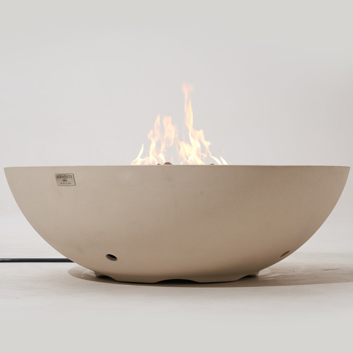 Elementi Pro Rose Bowl 48-inch 100K BTU fire pit, Frosted Cream White – low side profile, lit