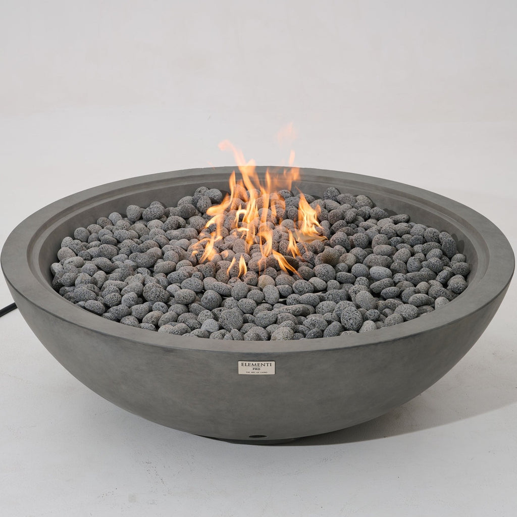 Elementi Pro Rose Bowl 48-inch 100K BTU fire pit, Moon Gray – angled view, lit